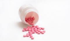 pink pills spilling out