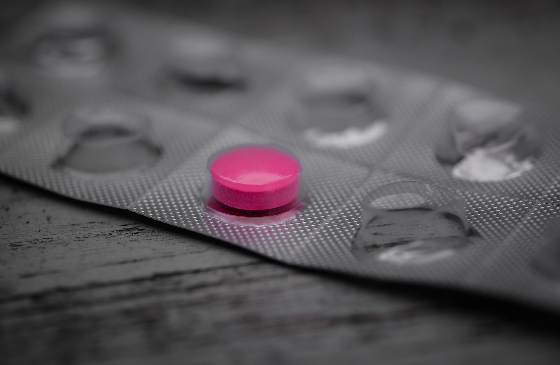 pink pills spilling out