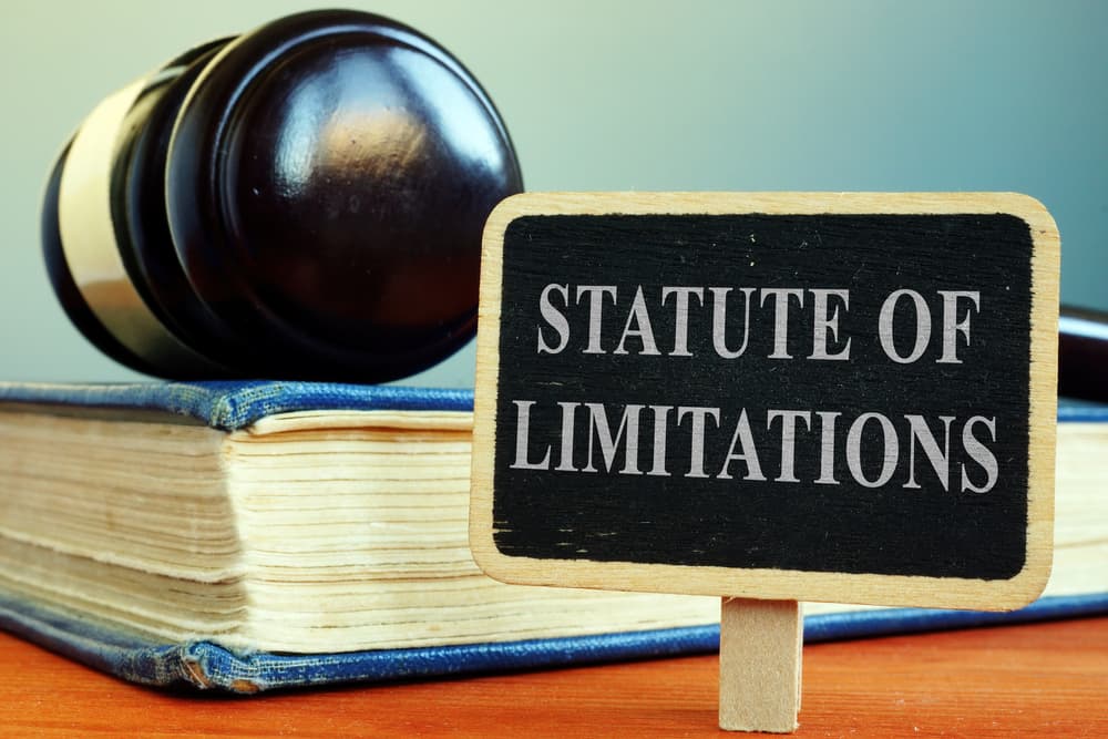 Statute of limitations concept with a sign, law book, and gavel, symbolizing legal time limits for filing claims.