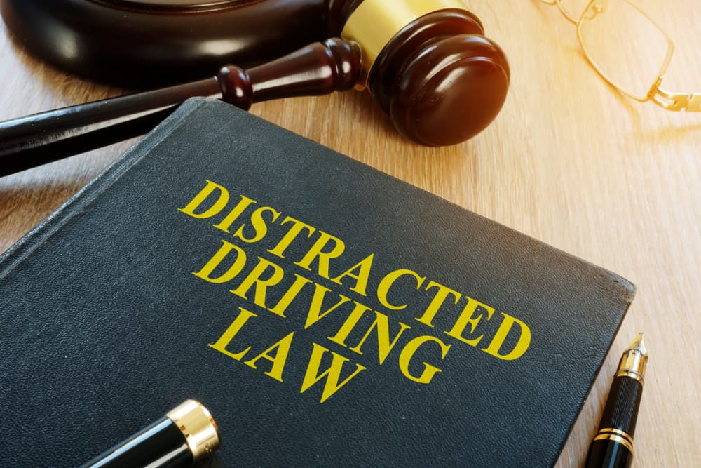 Distracted driving law and gavel on a desk.