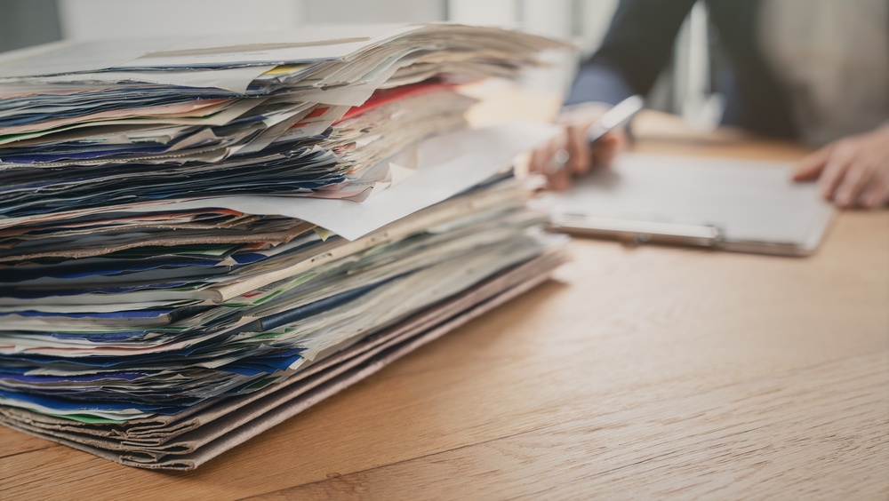 Legal partner reviews documentation and evidence relating to case